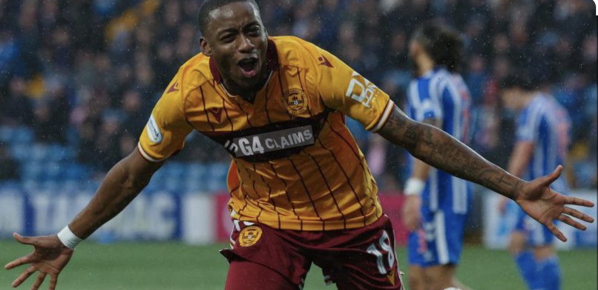Tawanda Maswanhise wheels away in celebration for Motherwell